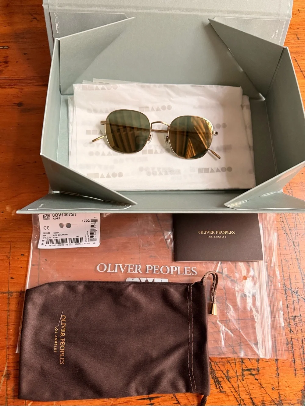 Oliver Peoples Adès Sunglasses OV1307ST Gold Titanium Frame Lenses G15 Goldtone